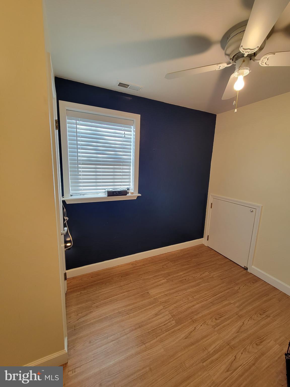 139 Mussetta Street Hanover, PA 17331 - Photo 54 of 58 a view of an empty room with wooden floor and a window