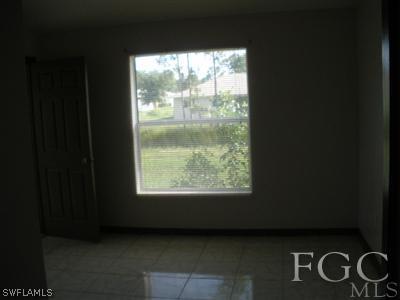 4713 28th Street Southwest Lehigh Acres, FL 33973 - Photo 4 of 8 a view of a livingroom with an empty space and window