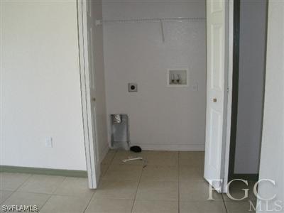 4713 28th Street Southwest Lehigh Acres, FL 33973 - Photo 5 of 8 a view of a storage & utility room