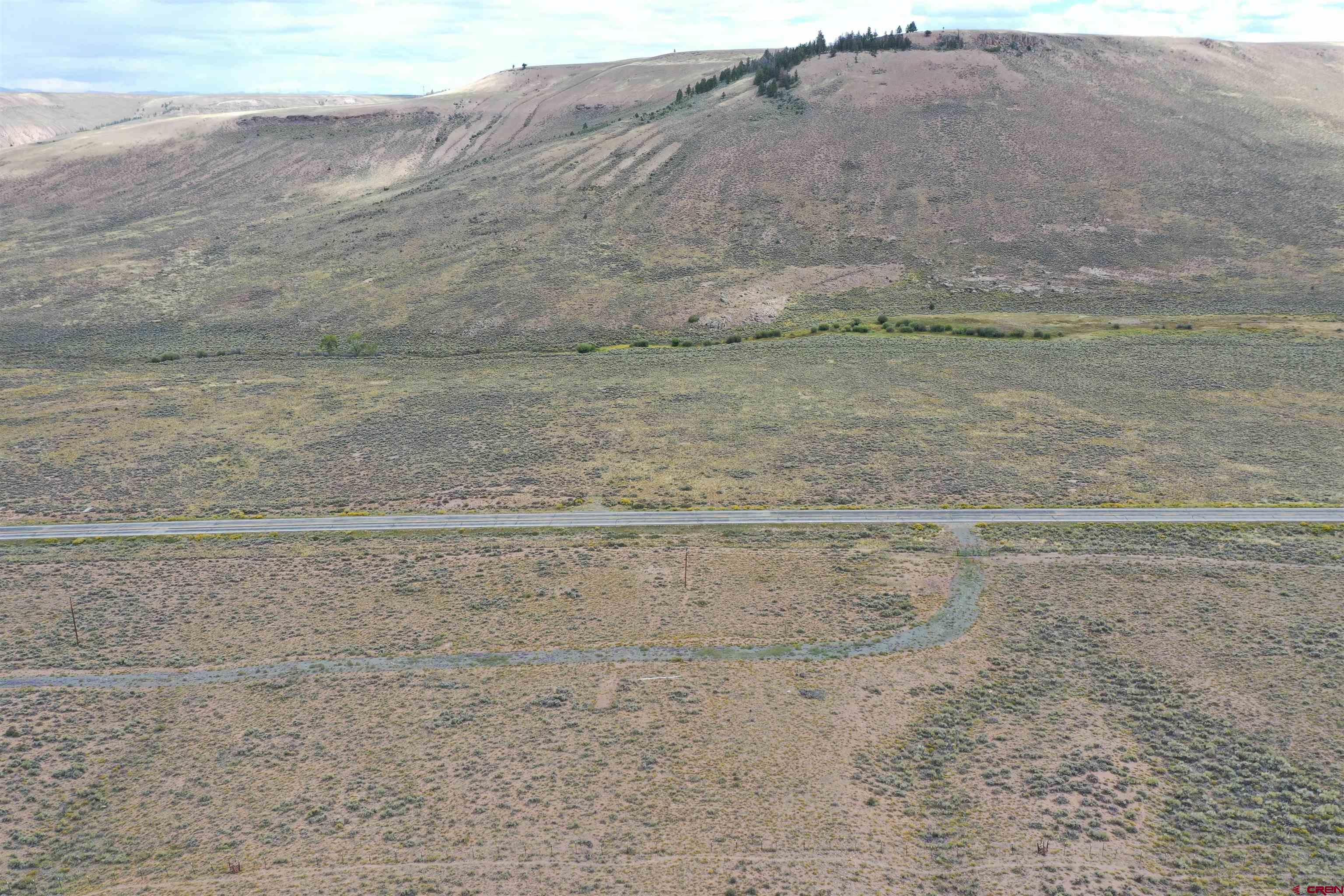 155 Spring Drive Gunnison, CO 81230 - Photo 9 of 15 a view of a dry field with trees