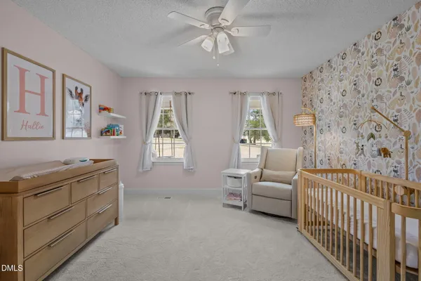 a living room with furniture and windows
