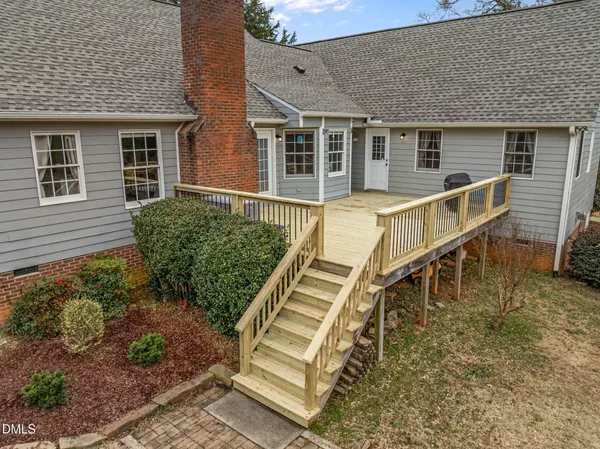 a front view of a house with wooden stairs