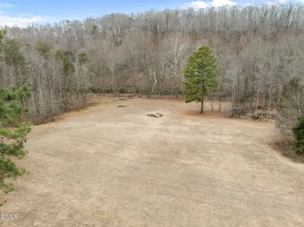 a view of a yard with trees