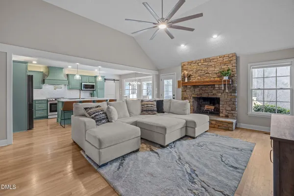 a living room with furniture and a fireplace