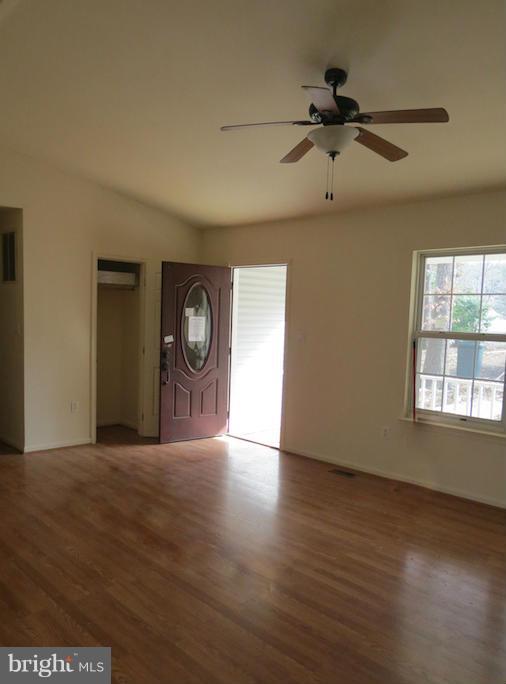 11520 Big Sandy Run Road Lusby, MD 20657 - Photo 2 of 7 a view of an empty room with a window