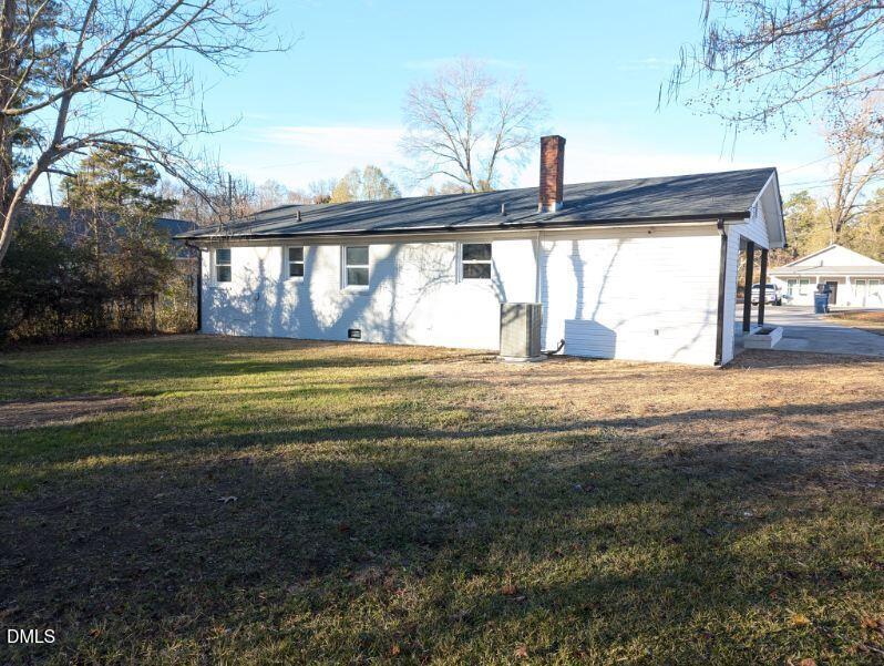 303 Stancil Street Smithfield, NC 27577 - Photo 12 of 13 a view of a house with a yard