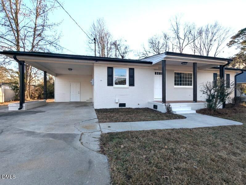 303 Stancil Street Smithfield, NC 27577 - Photo 2 of 13 a house view with a outdoor space