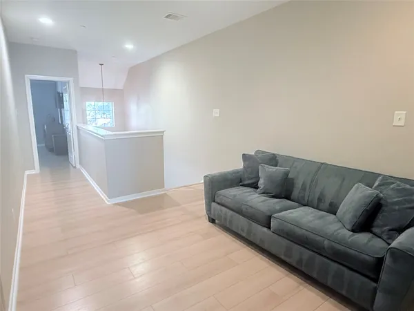a bedroom with a bed and cabinets