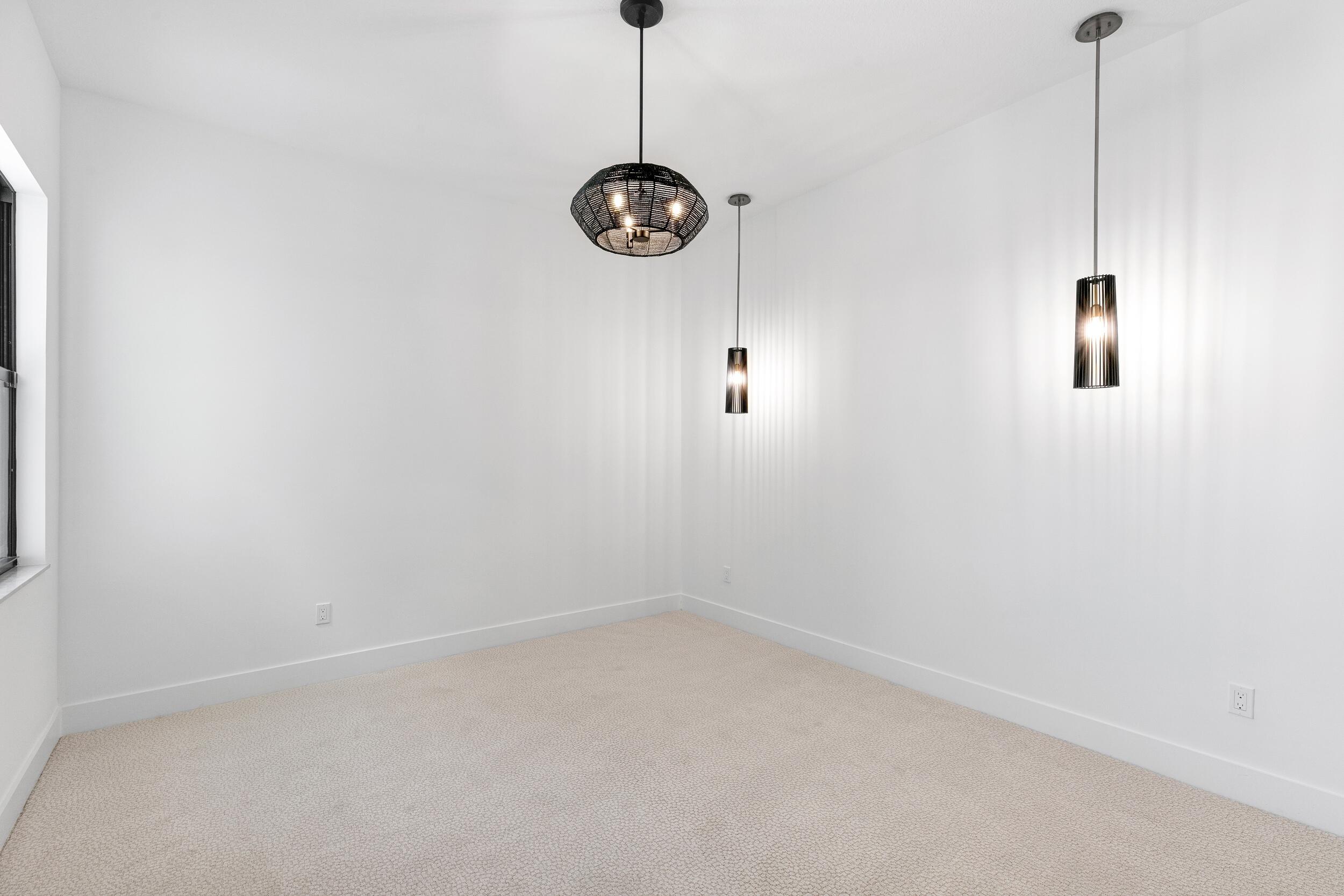 9893 Espresso Manor Boca Raton, FL 33496 - Photo 12 of 71 a view of a room with racks on the wall