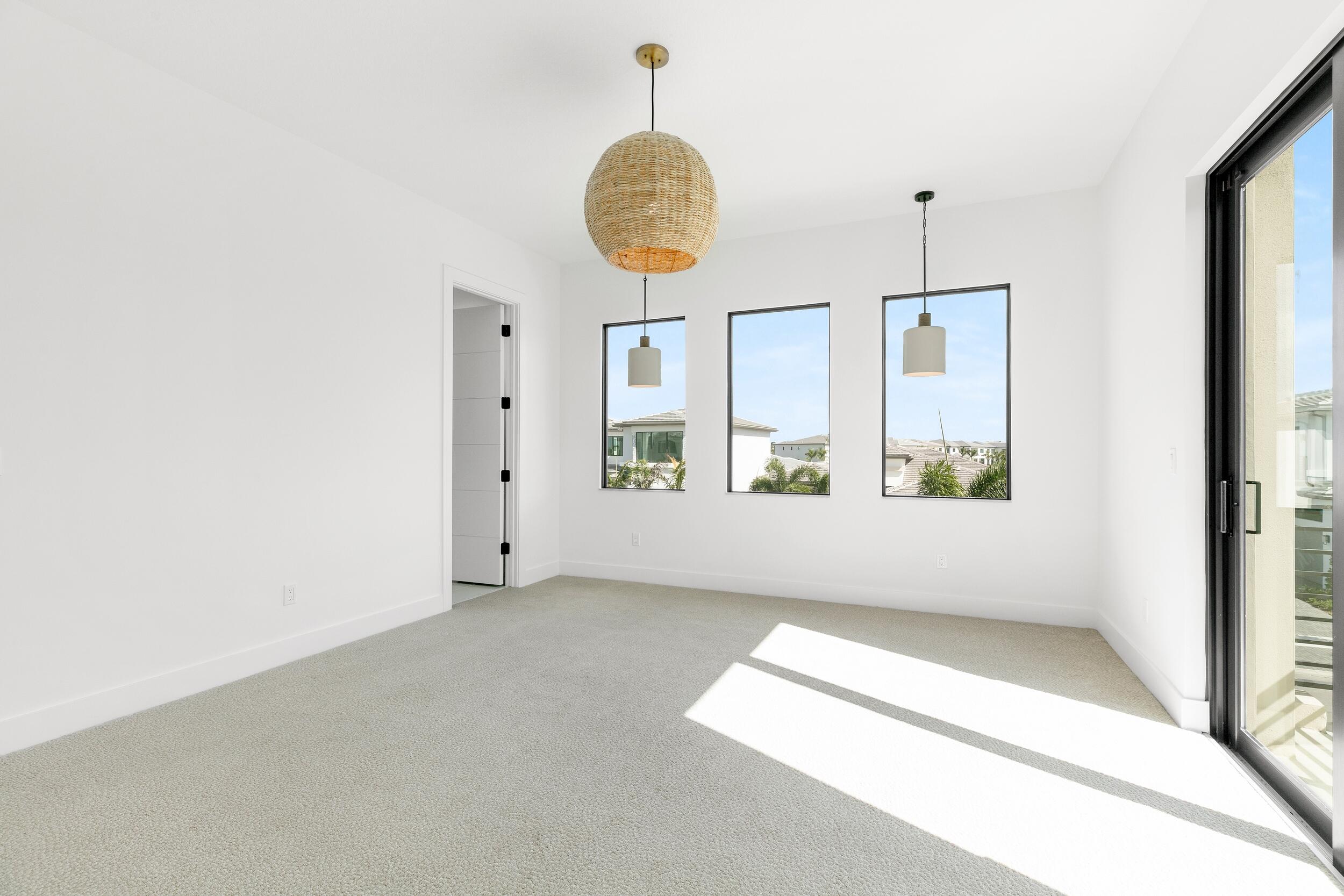 9893 Espresso Manor Boca Raton, FL 33496 - Photo 15 of 71 an empty room with windows and outdoor view