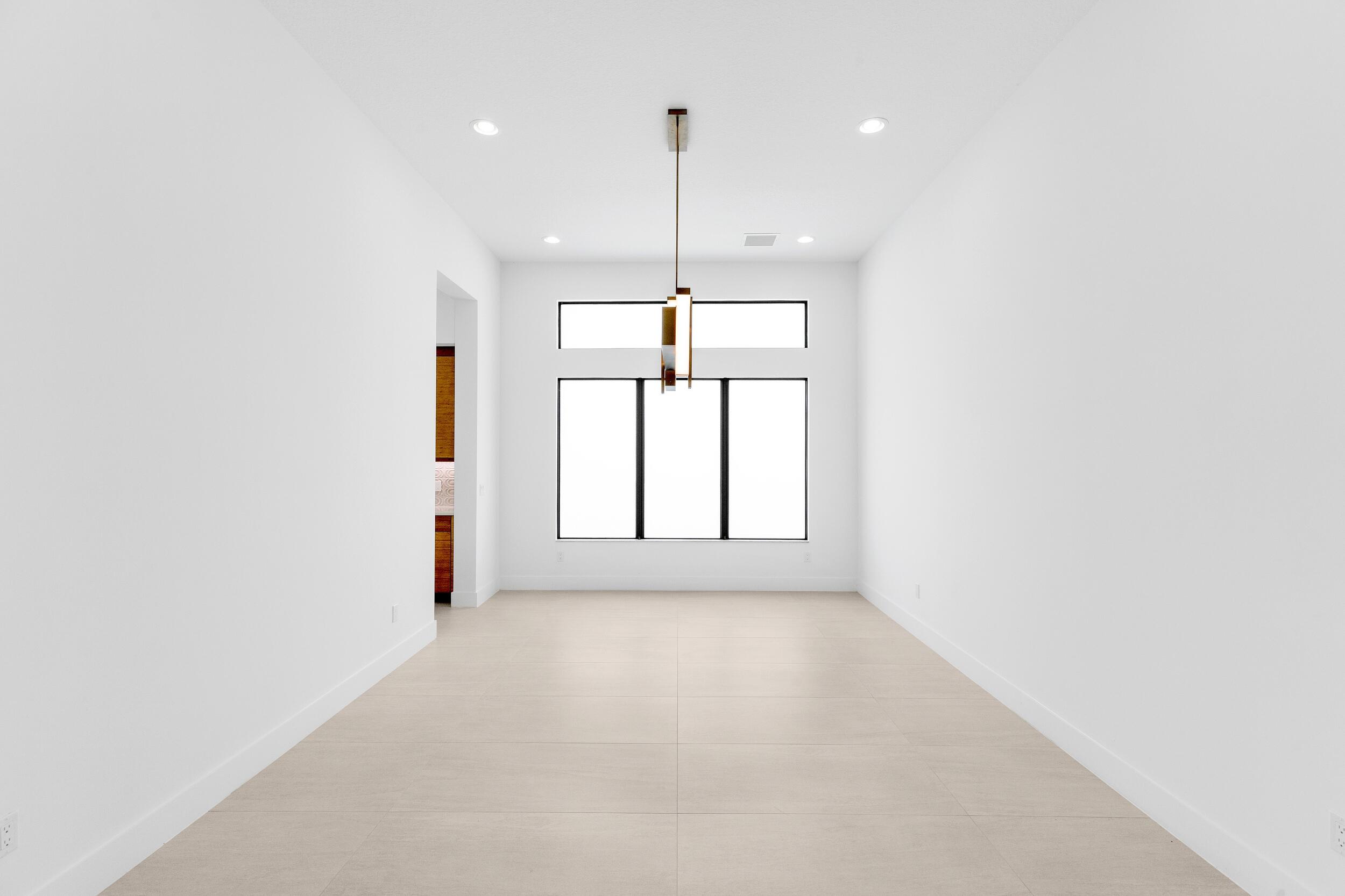 9893 Espresso Manor Boca Raton, FL 33496 - Photo 20 of 71 a view of an empty room with a window