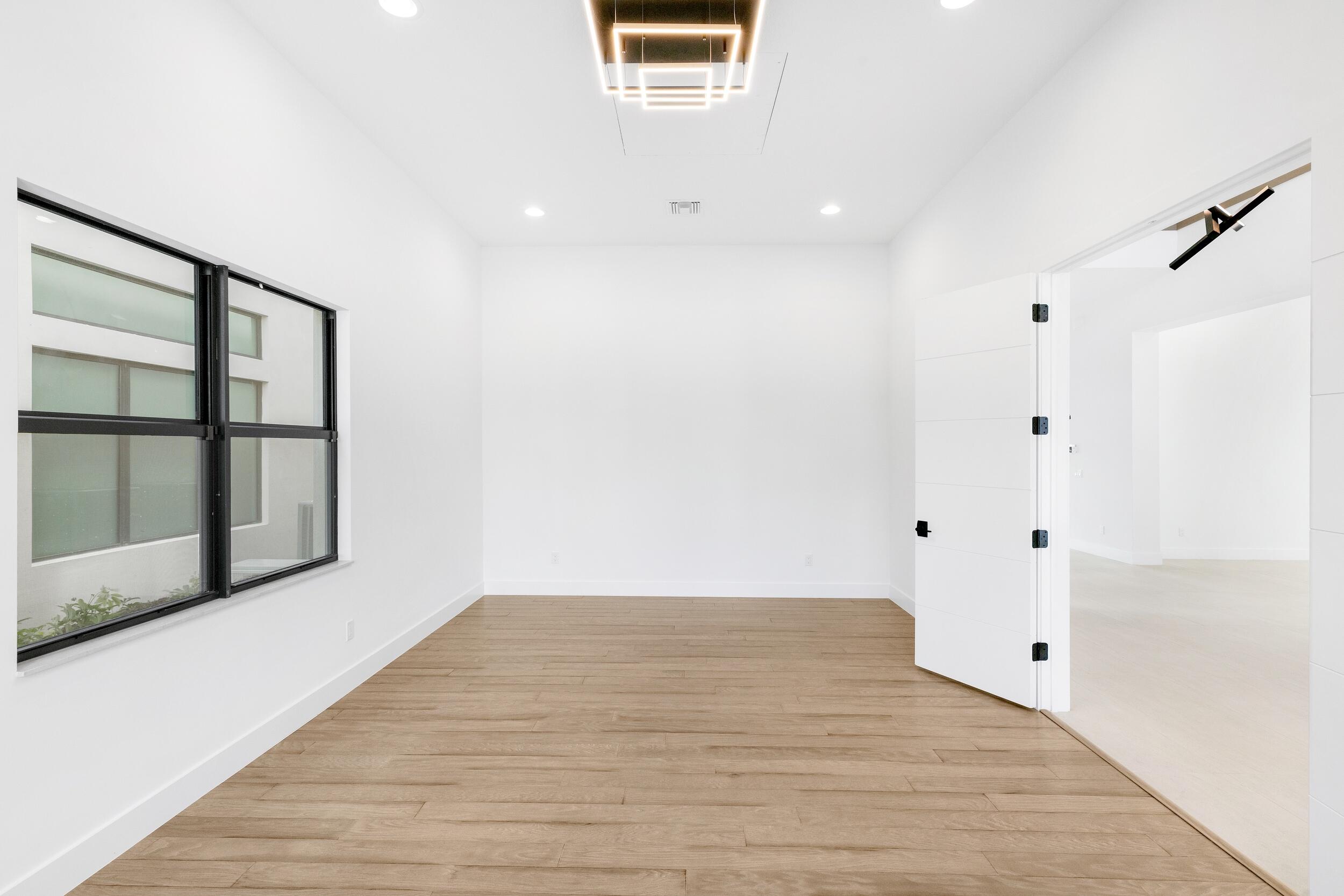 9893 Espresso Manor Boca Raton, FL 33496 - Photo 23 of 71 a view of an empty room with a window