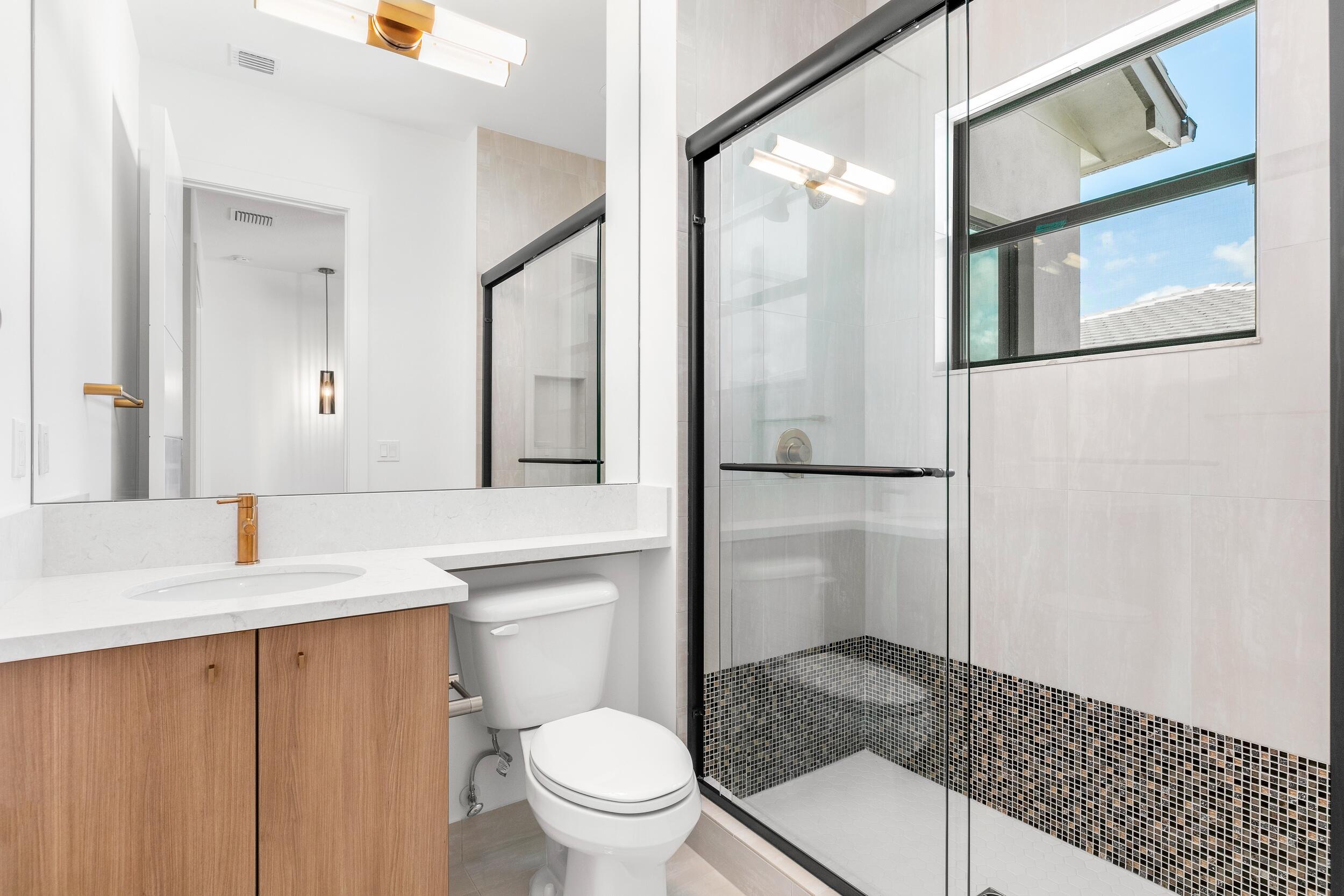 9893 Espresso Manor Boca Raton, FL 33496 - Photo 31 of 71 a bathroom with a granite countertop sink toilet and shower