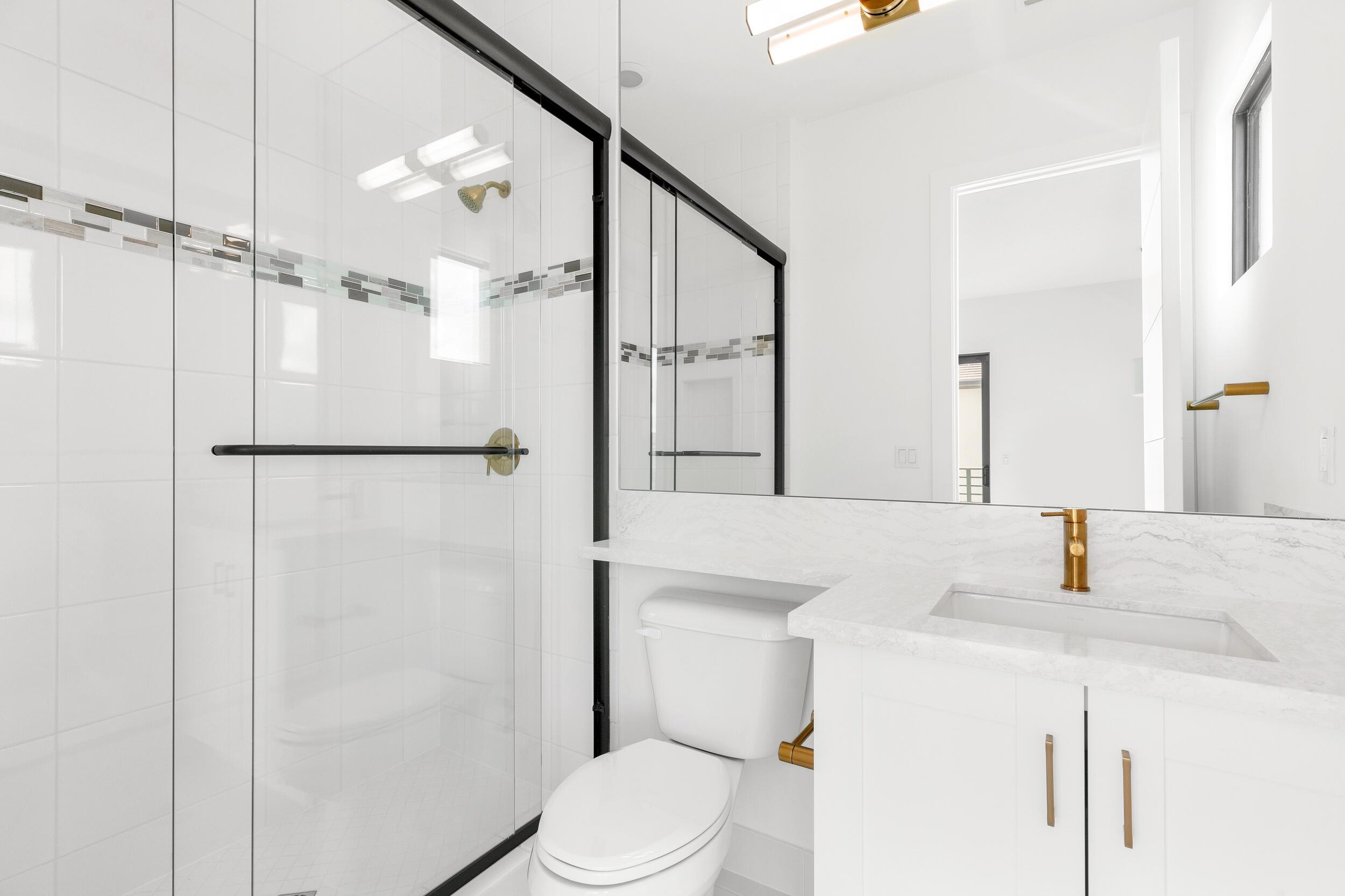 9893 Espresso Manor Boca Raton, FL 33496 - Photo 32 of 71 a bathroom with a sink a toilet and a mirror