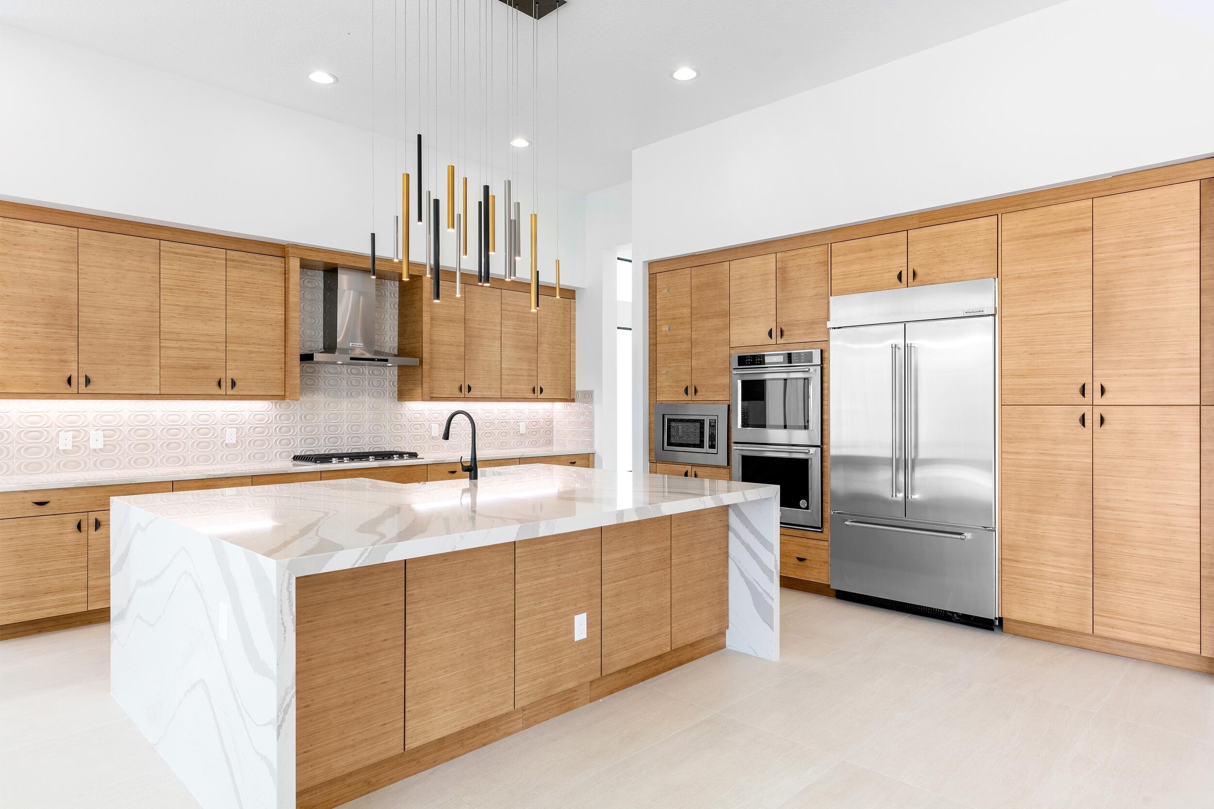 9893 Espresso Manor Boca Raton, FL 33496 - Photo 37 of 71 a kitchen with stainless steel appliances granite countertop a refrigerator and a sink