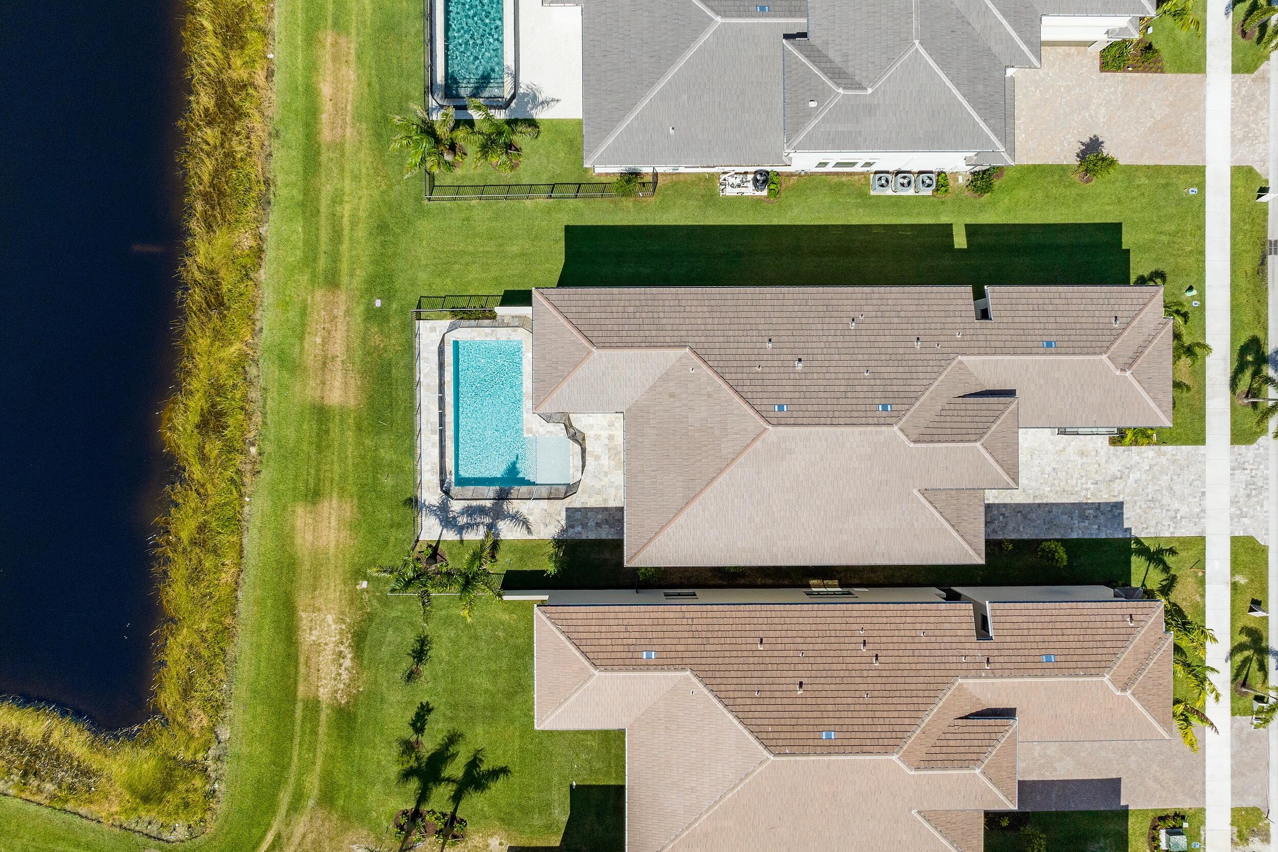 9893 Espresso Manor Boca Raton, FL 33496 - Photo 4 of 71 an aerial view of a house with a yard