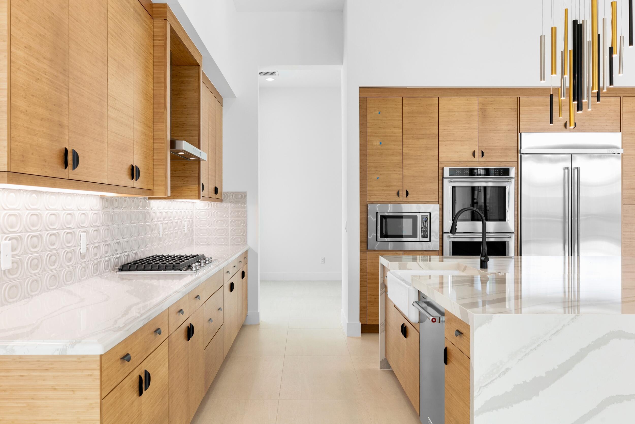 9893 Espresso Manor Boca Raton, FL 33496 - Photo 43 of 71 a kitchen with stainless steel appliances granite countertop a stove and a refrigerator