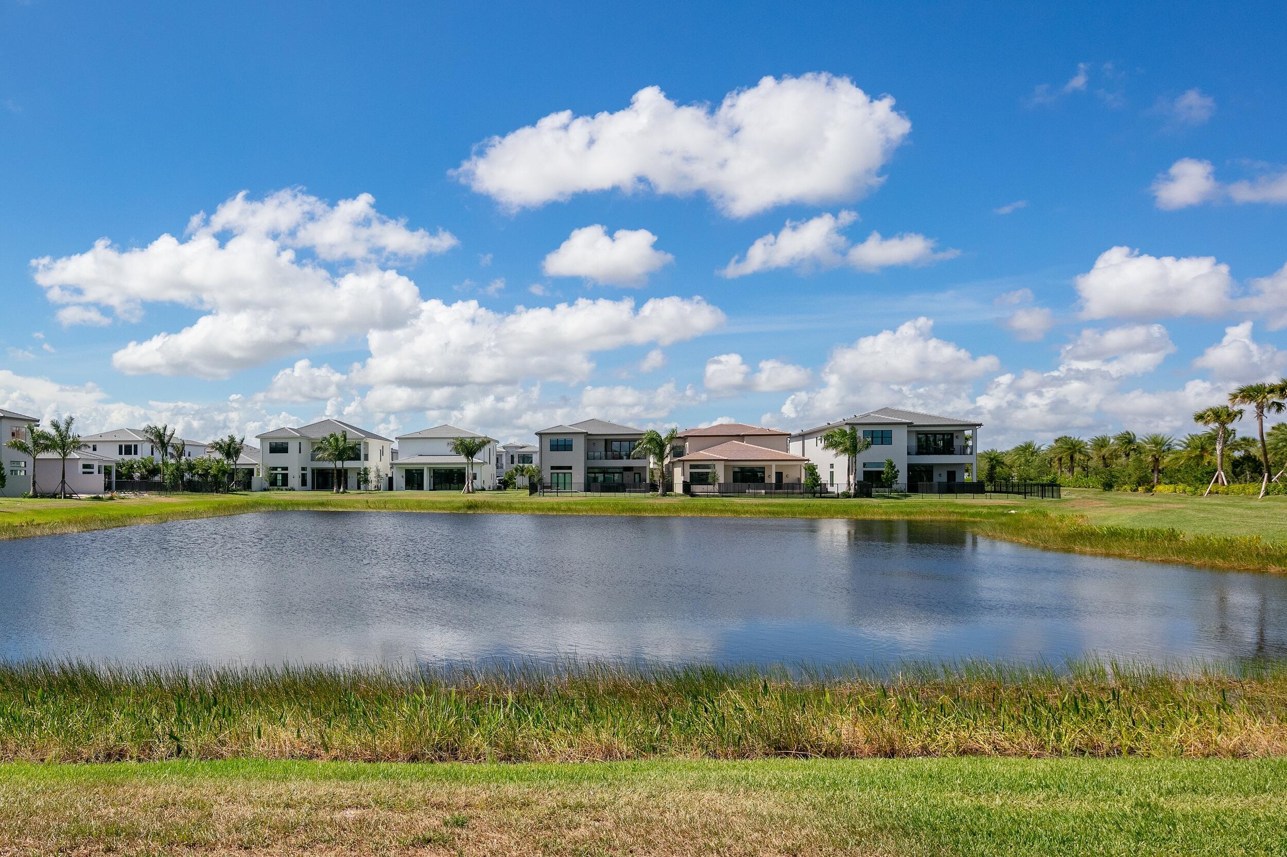 9893 Espresso Manor Boca Raton, FL 33496 - Photo 44 of 71 a view of a lake with houses in the background