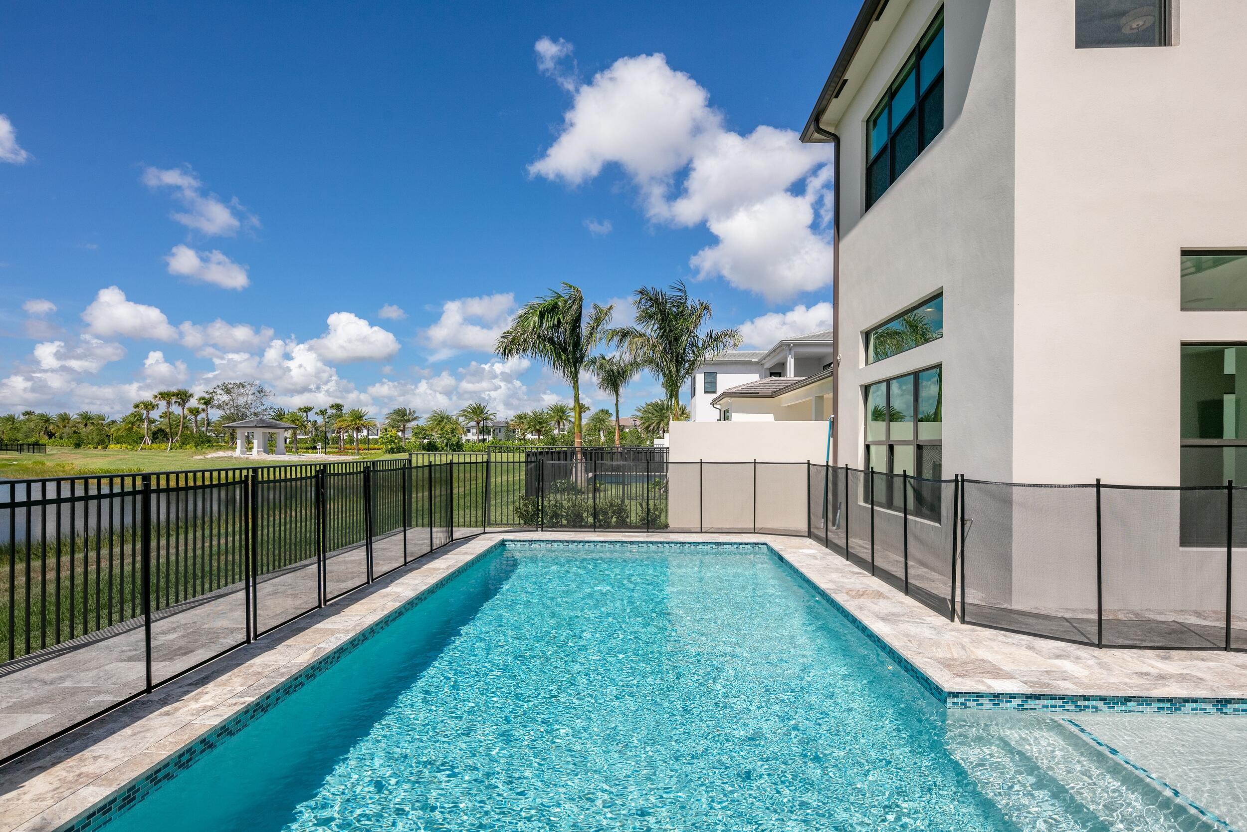 9893 Espresso Manor Boca Raton, FL 33496 - Photo 54 of 71 a view of a house with a backyard
