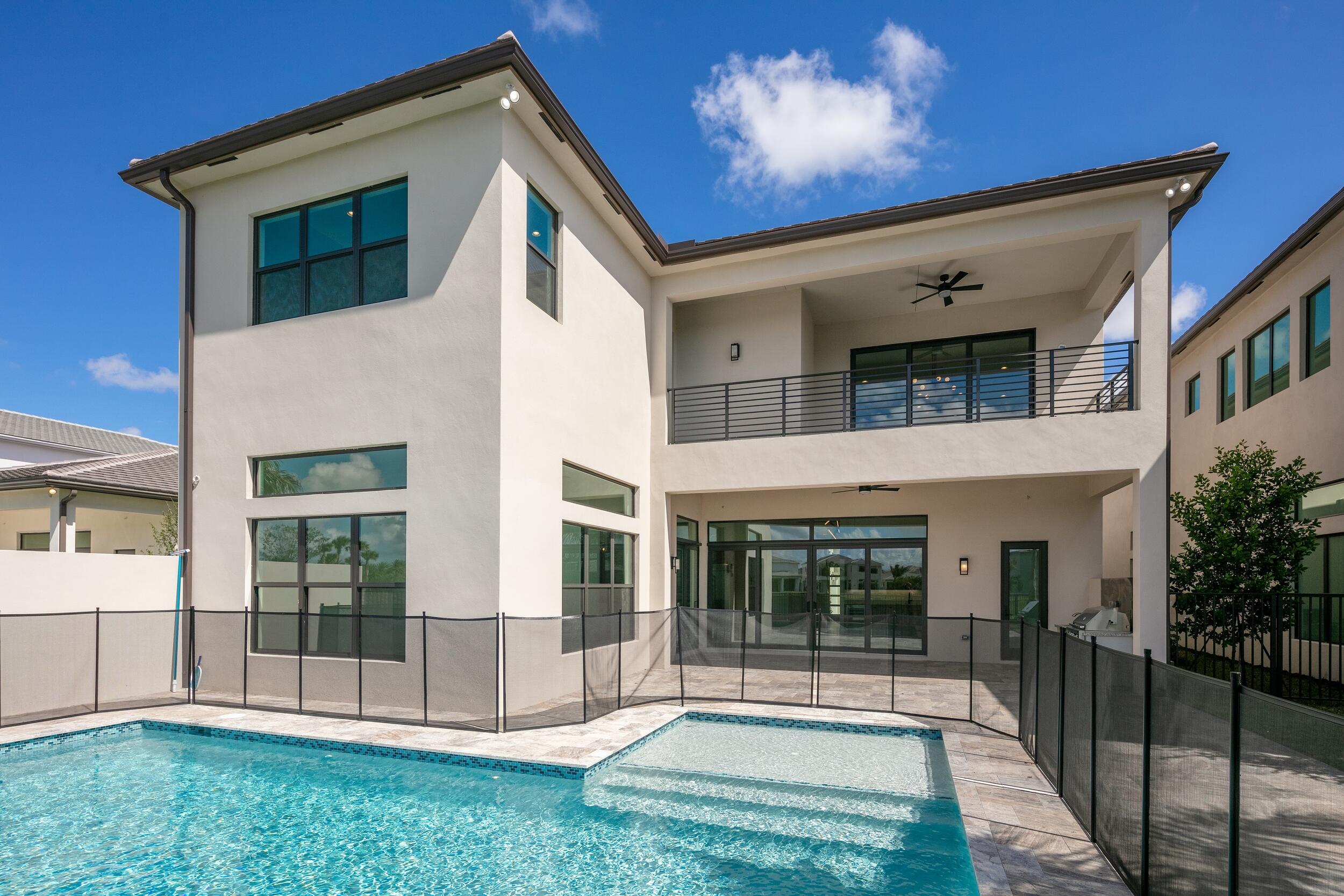 9893 Espresso Manor Boca Raton, FL 33496 - Photo 55 of 71 front view of a house with a yard