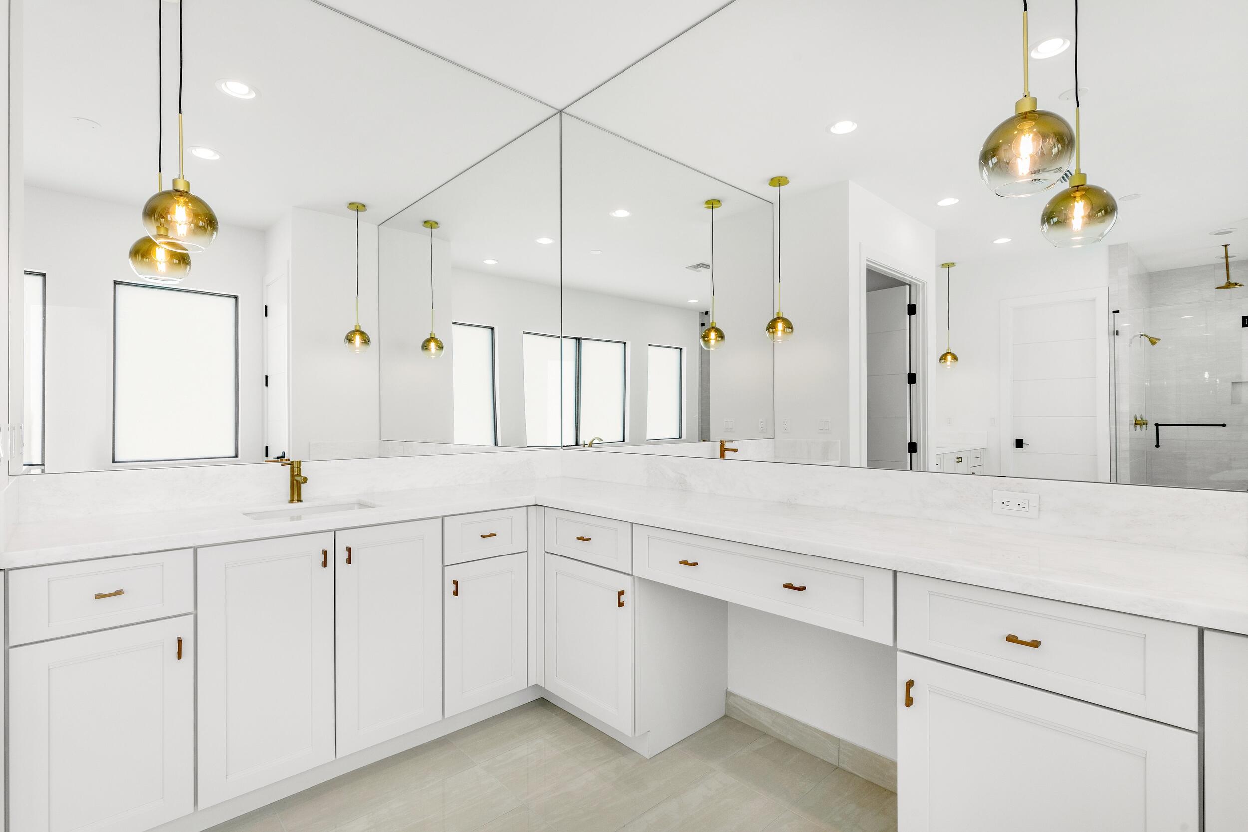 9893 Espresso Manor Boca Raton, FL 33496 - Photo 61 of 71 a large white kitchen with a sink and dishwasher with white cabinets