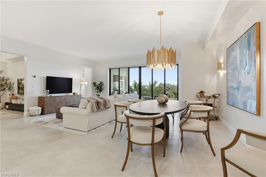 1125 Central Avenue, Unit 469 Naples, FL 34102 - Photo 12 of 38 a view of a dining room with furniture window and outside view