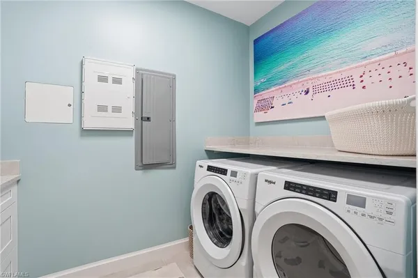 a view of a storage & utility room with washer and dryer