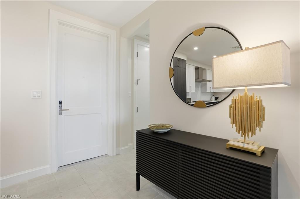 1125 Central Avenue, Unit 469 Naples, FL 34102 - Photo 32 of 38 a front view of a house with entryway