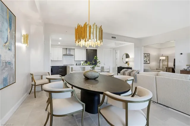 a kitchen with a table and chairs in it