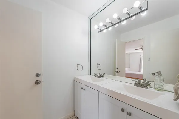 a bathroom with a sink and a mirror