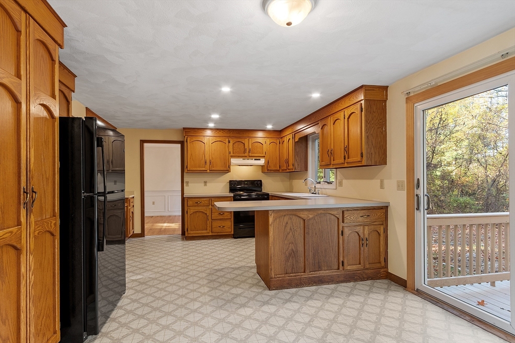 69 Blanchard Street Andover, MA 01810 - Photo 11 of 29 a large kitchen with stainless steel appliances granite countertop a refrigerator and a sink