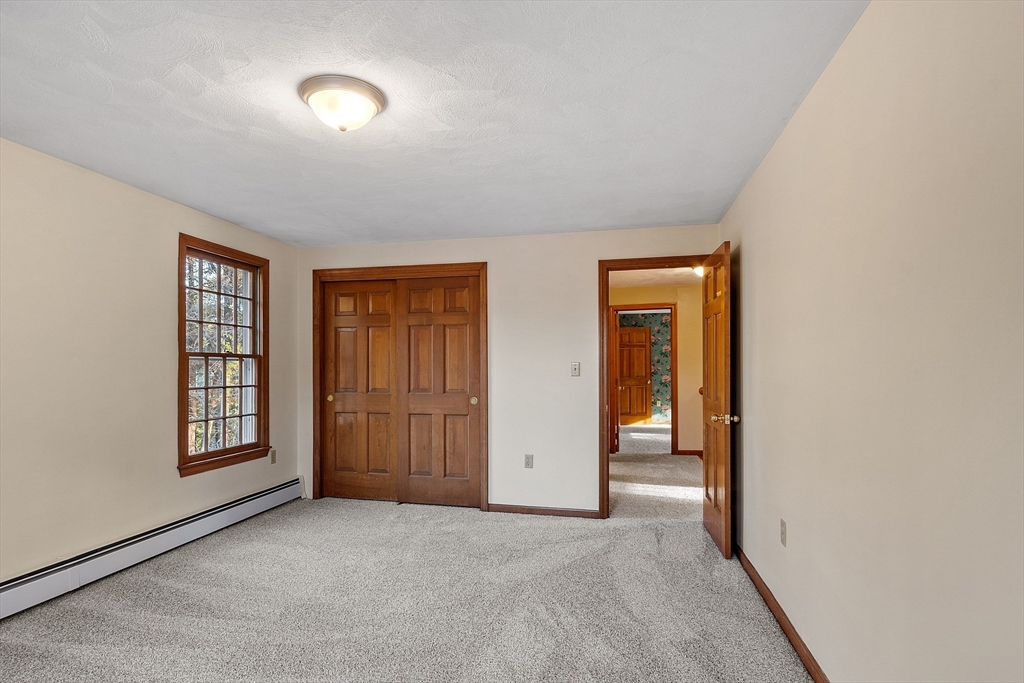 69 Blanchard Street Andover, MA 01810 - Photo 19 of 29 an empty room with windows and closet