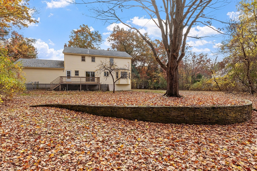 69 Blanchard Street Andover, MA 01810 - Photo 2 of 29 a front view of a house with a yard