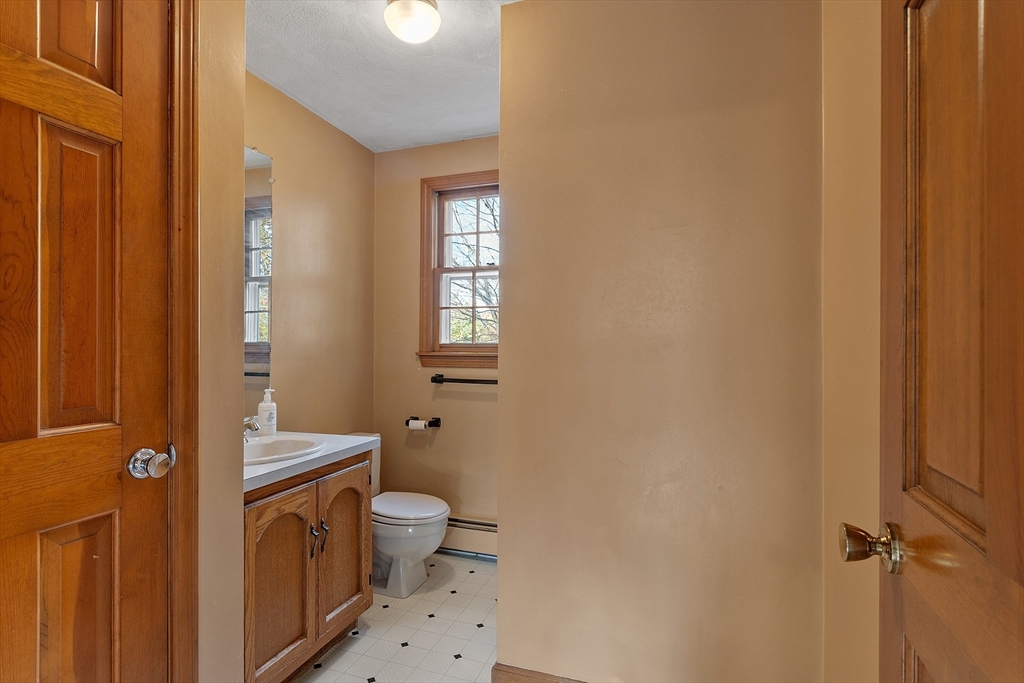 69 Blanchard Street Andover, MA 01810 - Photo 24 of 29 a bathroom with a toilet a sink and a window