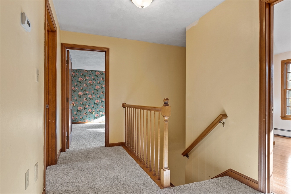 69 Blanchard Street Andover, MA 01810 - Photo 25 of 29 a view of a hallway with wooden floor and entryway