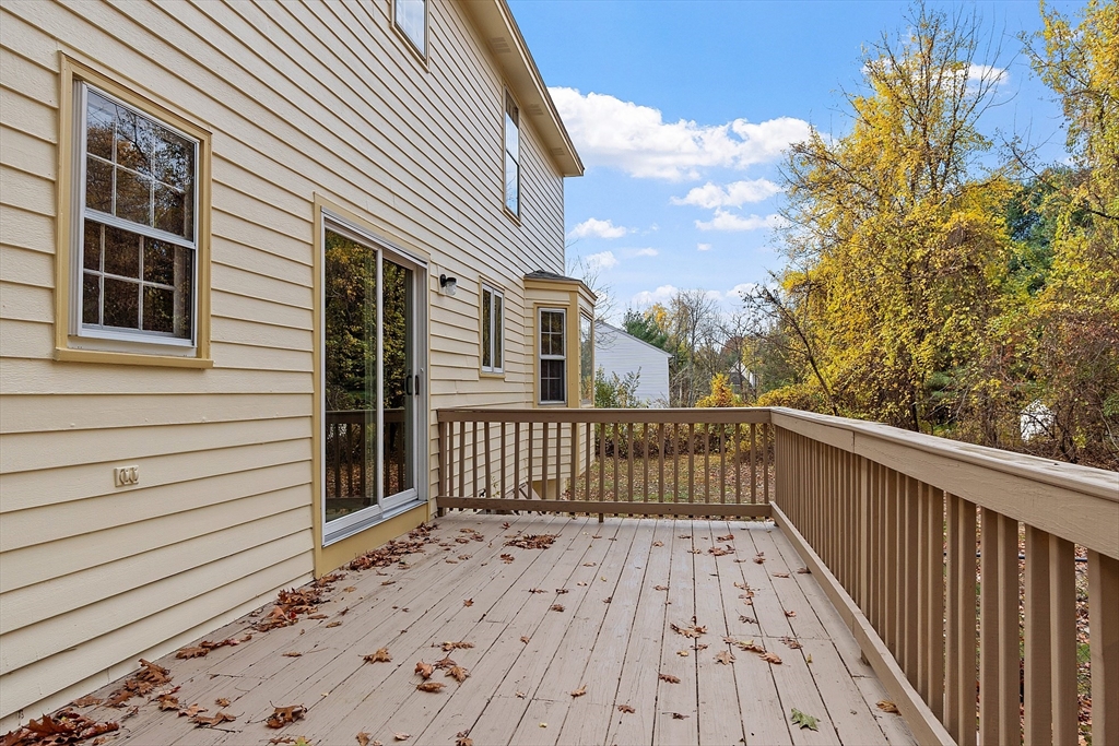 69 Blanchard Street Andover, MA 01810 - Photo 3 of 29 a view of a wooden fence and a pathway