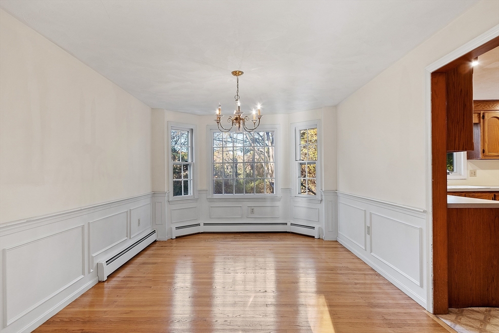 69 Blanchard Street Andover, MA 01810 - Photo 5 of 29 a view of empty room with window and wooden floor