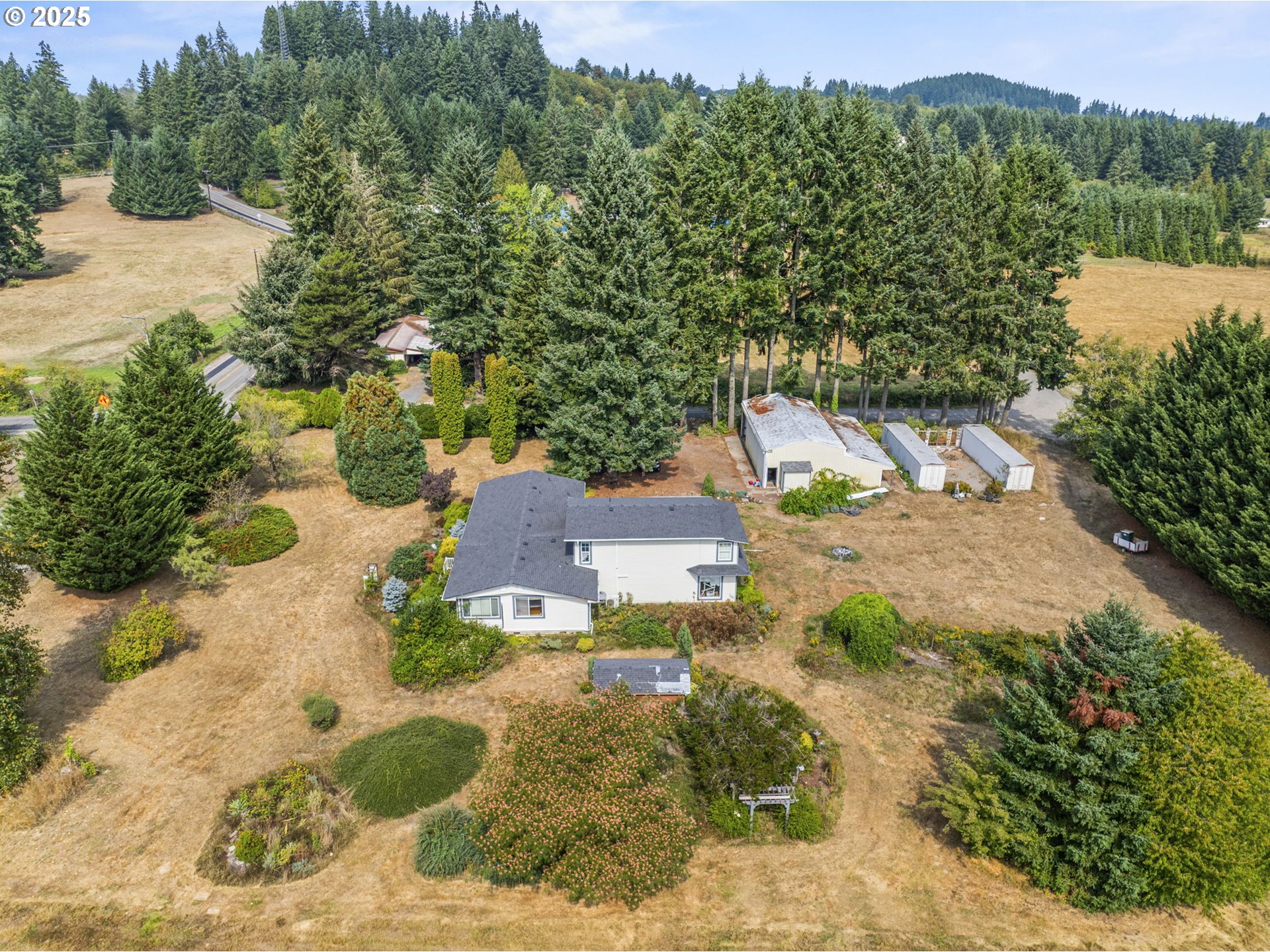 135 Westside Highway Vader, WA 98593 - Photo 2 of 31 an aerial view of a house with a yard