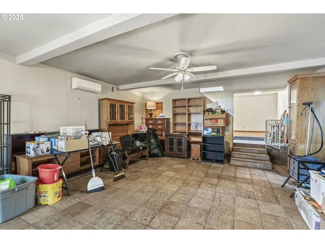 a living room with lots of furniture and a chandelier