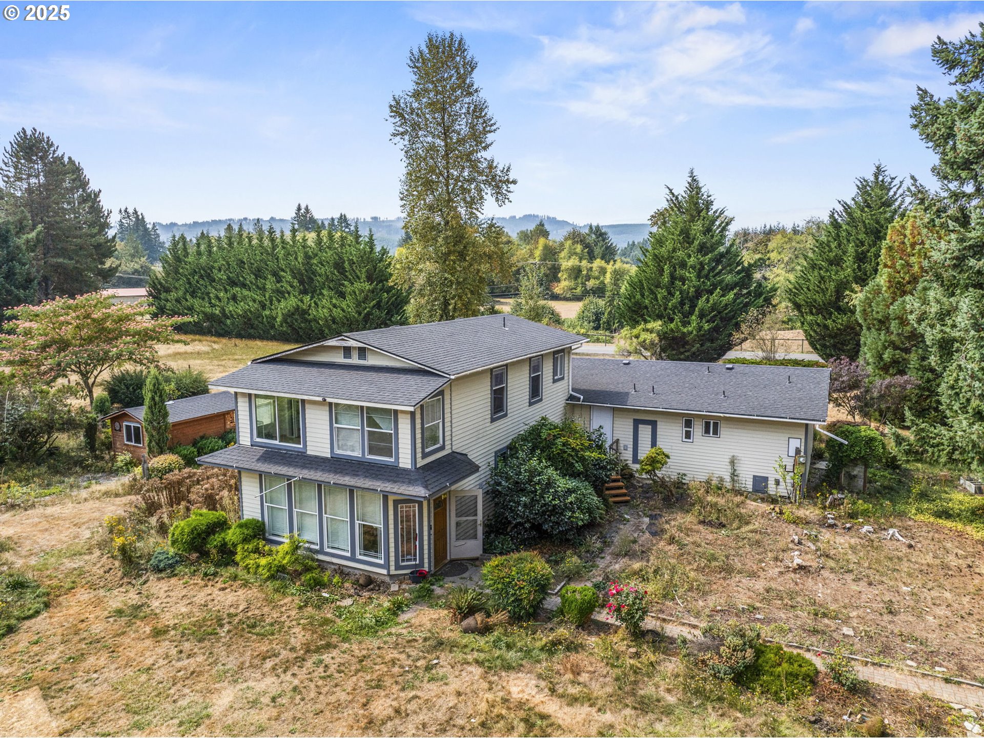 135 Westside Highway Vader, WA 98593 - Photo 9 of 31 a aerial view of large residential houses with yard and trees in the background