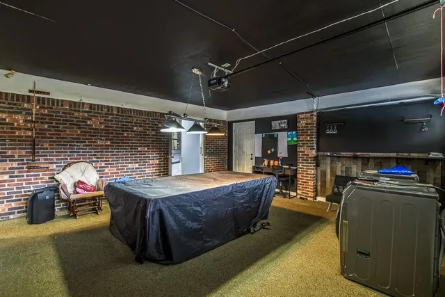 a view of a patio with table and chairs a barbeque