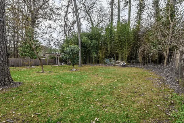 a backyard of a house with lots of green space