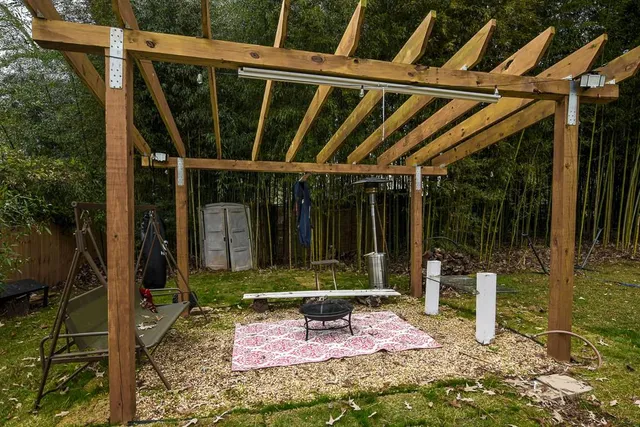 a chair and table in front of a house