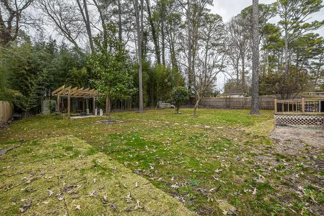 a backyard of a house with lots of green space