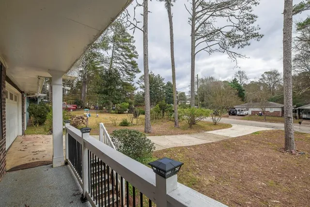 a view of a porch with yard and sitting area