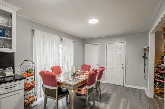 a view of a dining room with furniture and window