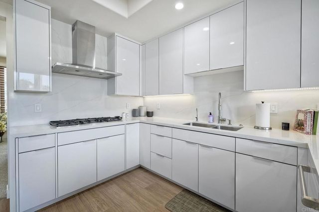 a kitchen with cabinets and appliances