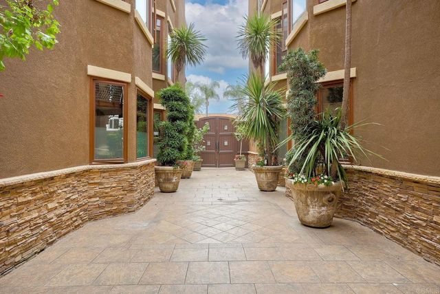 a view of a yard with potted plants