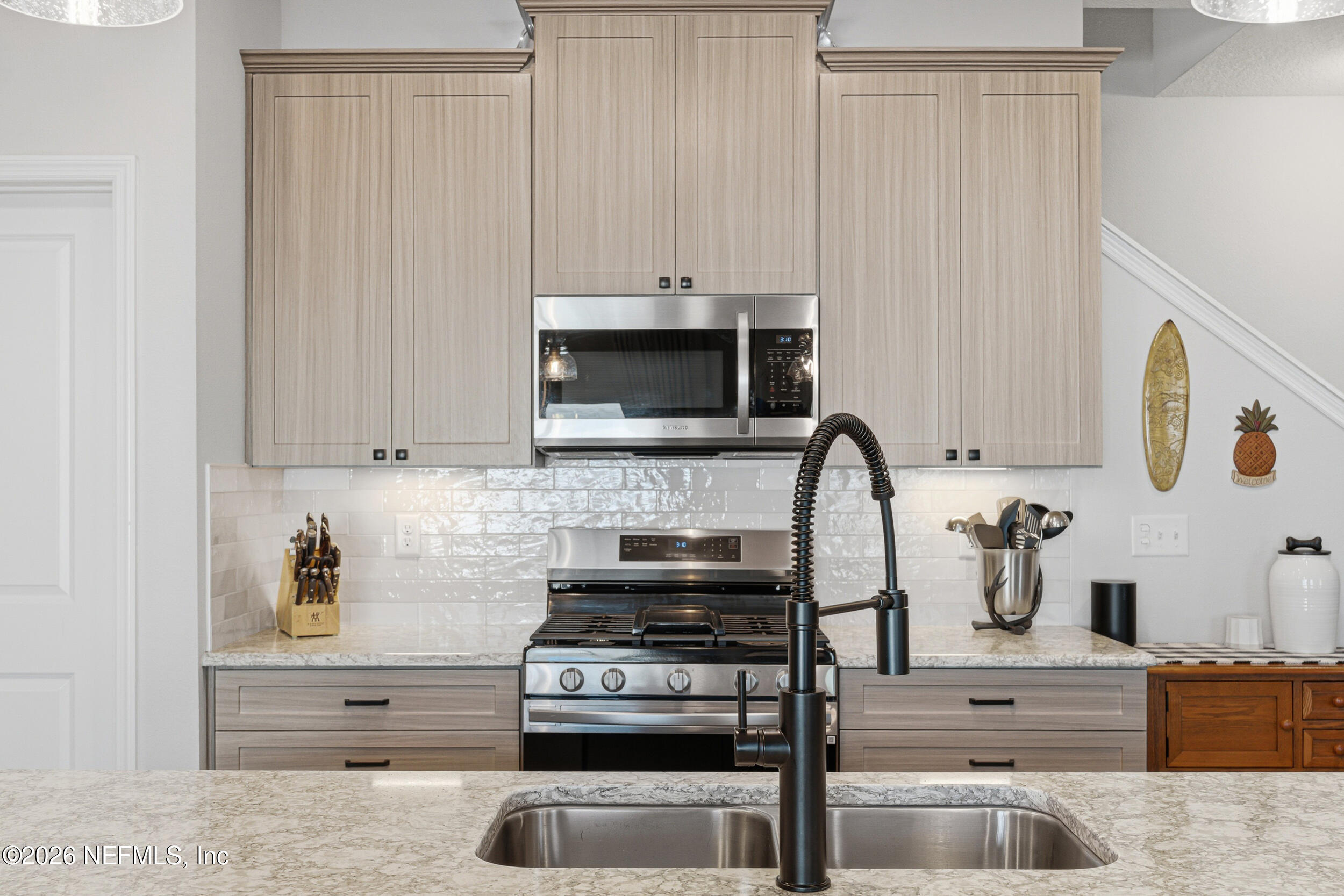 507 Narrowleaf Drive St. Johns, FL 32259 - Photo 12 of 79 a kitchen with granite countertop a stove and a sink