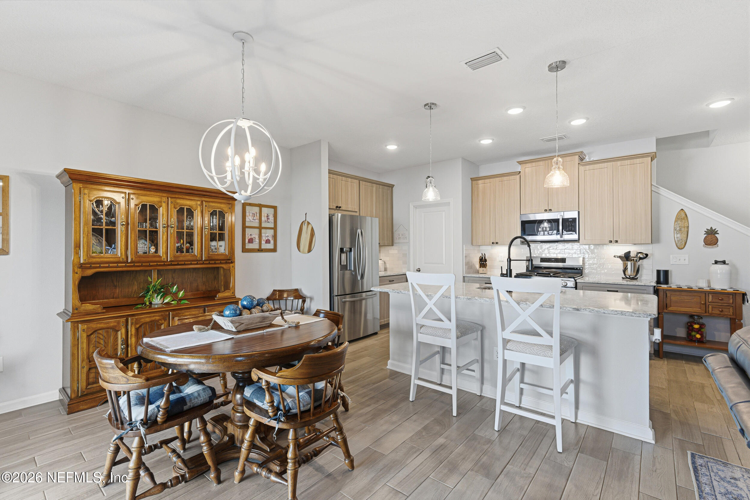507 Narrowleaf Drive St. Johns, FL 32259 - Photo 16 of 79 a view of a dining room with furniture wooden floor and chandelier